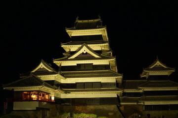 Fototapeta premium SAKURA, Cherry Blossoms at night time in Matsumoto castle, Nagano, Japan.