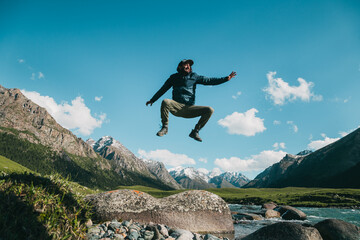 happy guy jumping in nature