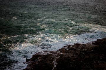 waves crashing on rocks