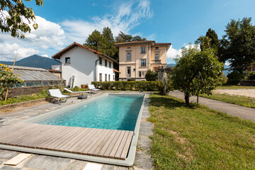 Ancient villa with swimming pool on a sunny summer day