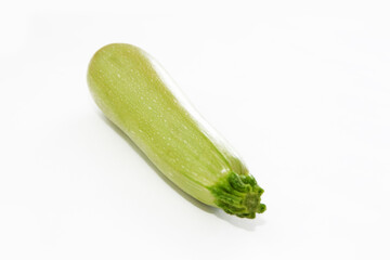 fruit natural green zucchini on a white background