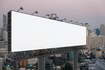 Blank white road billboard with Bangkok cityscape background at sunset. Street advertising poster, mock up, 3D rendering. Side view. The concept of marketing communication to promote or sell idea.