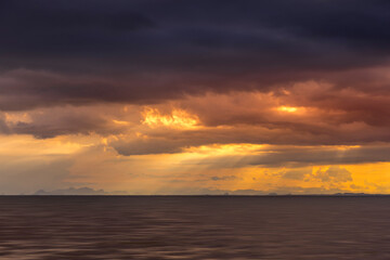 Fototapeta na wymiar Seascape and clouds in rain season with sunlight.