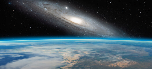 Planet Earth with a spectacular sunset, Andromeda galaxy in the background "Elements of this image furnished by NASA"