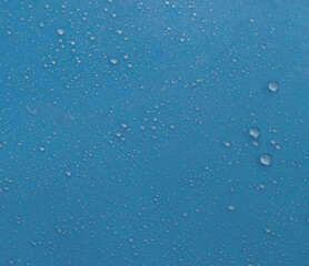Water drops on a blue background. Clean water