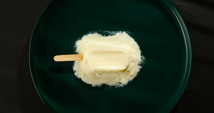 leben or yoghourt flavor popsicle melting in a shade of a window timelapse
