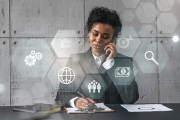 Businesswoman speaks phone andbusiness theme hologram. Double exposure.