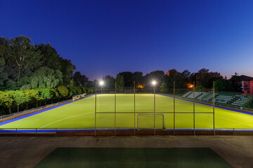 Field hockey stadium with lights at night