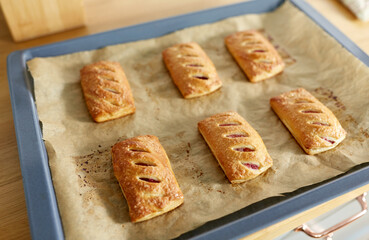 food cooking, culinary and pastry concept - close up of baking tray with jam pies at home kitchen