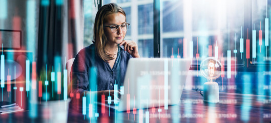 Businesswoman working at modern office.Technical price graph and indicator, red and green...