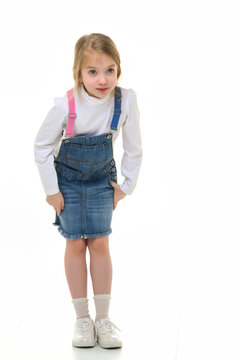 Little girl in a short denim dress.