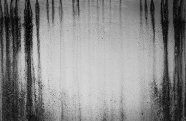 Black and white dirty wall surface There are stains of sewage on it with vignetting