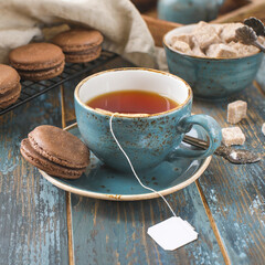 Vintage tea Cup on blue wooden background