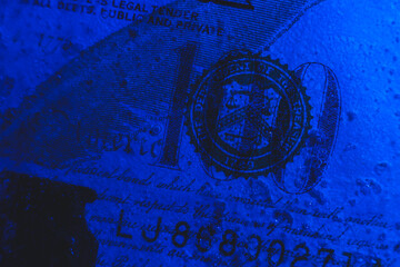 New $ 100 bill frozen under a layer of ice, the concept of the global financial crisis or the fall of the dollar on the world market