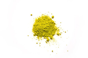 Green powder of Japanese matcha tea on a platter, isolated on a white background. Loose powder. Space for text. Cafe and cooking, an ingredient for an invigorating drink