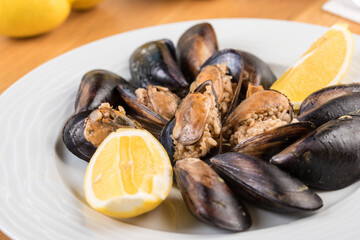 Turkish Delicious Rice Stuffed Mussels serving with lemon. Turkish Midye Dolma