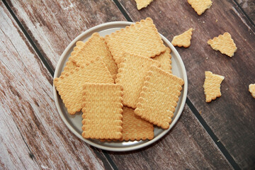 edible square dry cookies in a plate