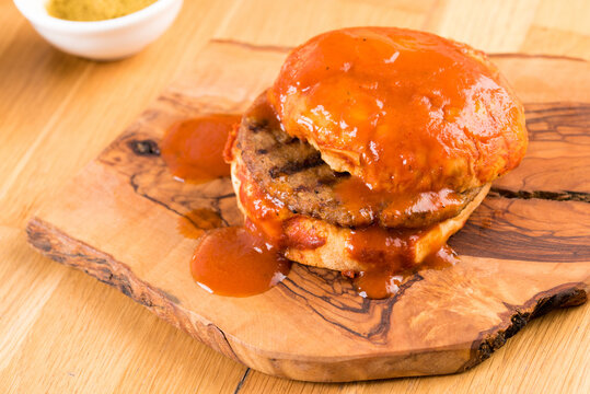 Delicious Turkish islak hamburger or wet burger on wooden table