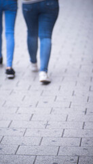 People walking sidewalk pavement