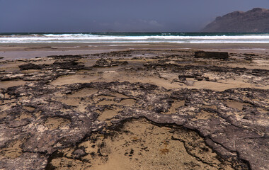 Lanzarote, volcanic rock in low tide on Caleta de Famara