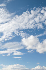 White clouds on a background of blue sky.