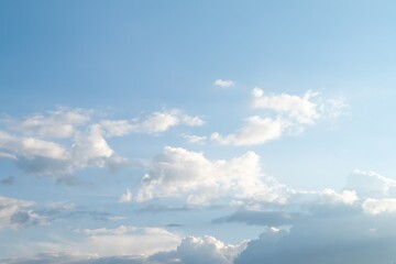 Naklejka na ściany i meble White clouds against the blue sky.