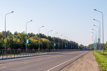 Fototapeta na wymiar Autobahn, road in a summer forest, Kazakhstan.