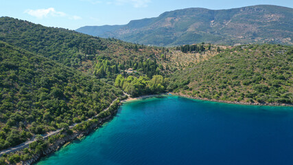 Obraz na płótnie Canvas Aerial drone photo of beautiful paradise beach of Skinos covered in pine trees in beautiful Ionian island of Ithaki or Ithaca, Greece