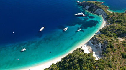 Aerial drone photo of beautiful paradise beach of Skinos covered in pine trees in beautiful Ionian island of Ithaki or Ithaca, Greece