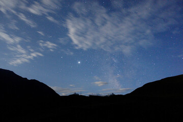 Starry sky and milky way in the mountains. Starry sky and milky way in the mountains. Mountain village against the background of the night starry sky and the milky way.
