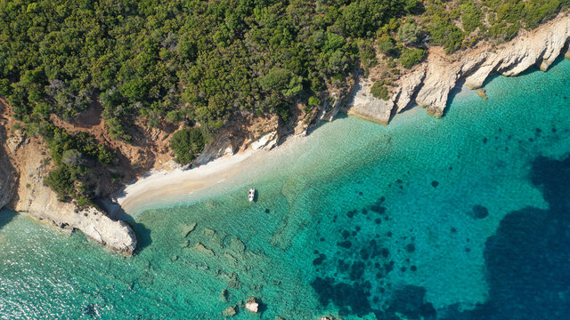 Aerial drone photo of secluded paradise sandy bay a safe anchorage for sail boats and yachts with turquoise bay, Ithaki or Ithaca island, Ionian, Greece