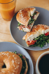 delicious and appetizing breakfast: a bagel stuffed on a plate