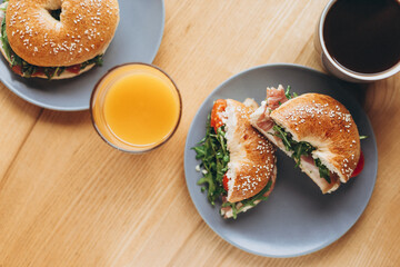 cut in half a bagel which is full of delicious juicy stuffing. Appetizing breakfast close up