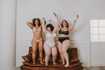 Plus size women posing for body acceptance
