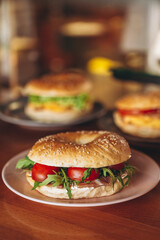 delicious and appetizing breakfast: a bagel stuffed on a plate