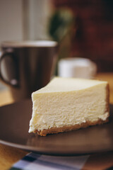 Piece of cake with coffee for breakfast on the table in a coffee shop