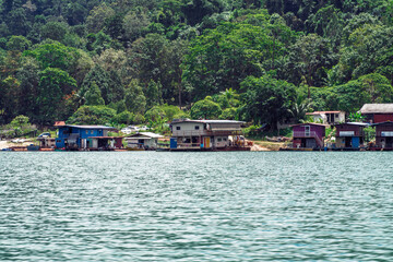 Fototapeta na wymiar Houseboats anchored in Kenyir Lake. Malaysia tourist attraction both for local and international.