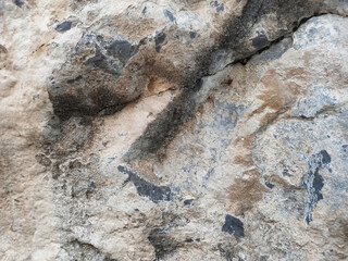 grey stone wall texture with cracks background