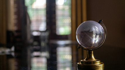 Transparent globe on the table