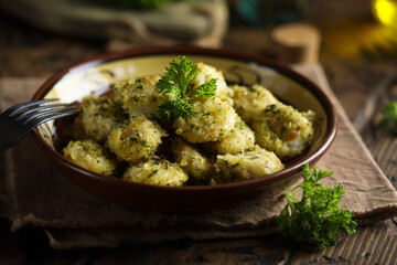 Homemade potato gnocchi with parsley pesto and bread crumbs