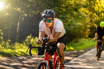 Plexiglas foto achterwand cyclist on a gravel bike during the route © BlackMediaHouse