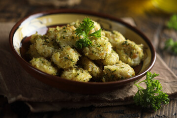 Homemade potato gnocchi with parsley pesto and bread crumbs