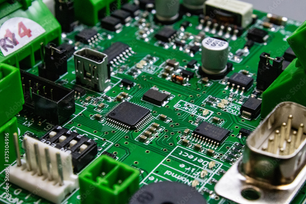 Wall mural green circuitboard with microcontroller and lots of connectors