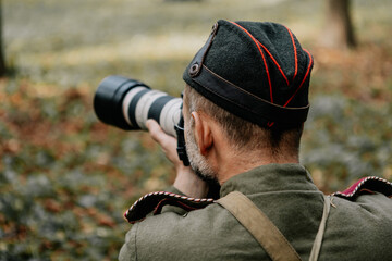 13.10.2019 Vinnitsa, Ukraine: military photographer with camera in his hands during World War II...