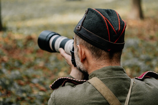 13.10.2019 Vinnitsa, Ukraine: military photographer with camera in his hands during World War II military reconstruction