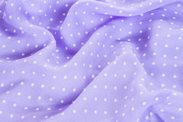 violet polka dots silk background texture top view