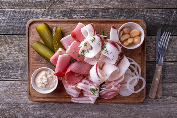 Assorted of lard with marinated cucumbers, garlic and onion. Top view