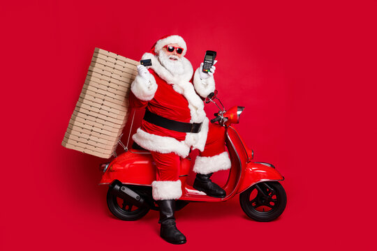 Full length profile photo of retired grandfather retro moped many pizza box hold credit contactless cashless card terminal wear x-mas costume coat sunglass cap isolated red color background