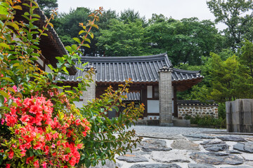 The beautiful traditional house, garden  and forest  at summer.