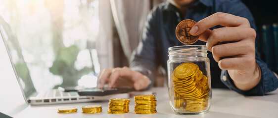 Business people use tablets and hold credit cards as an online shopping concept With a calculator and a book placed on the table